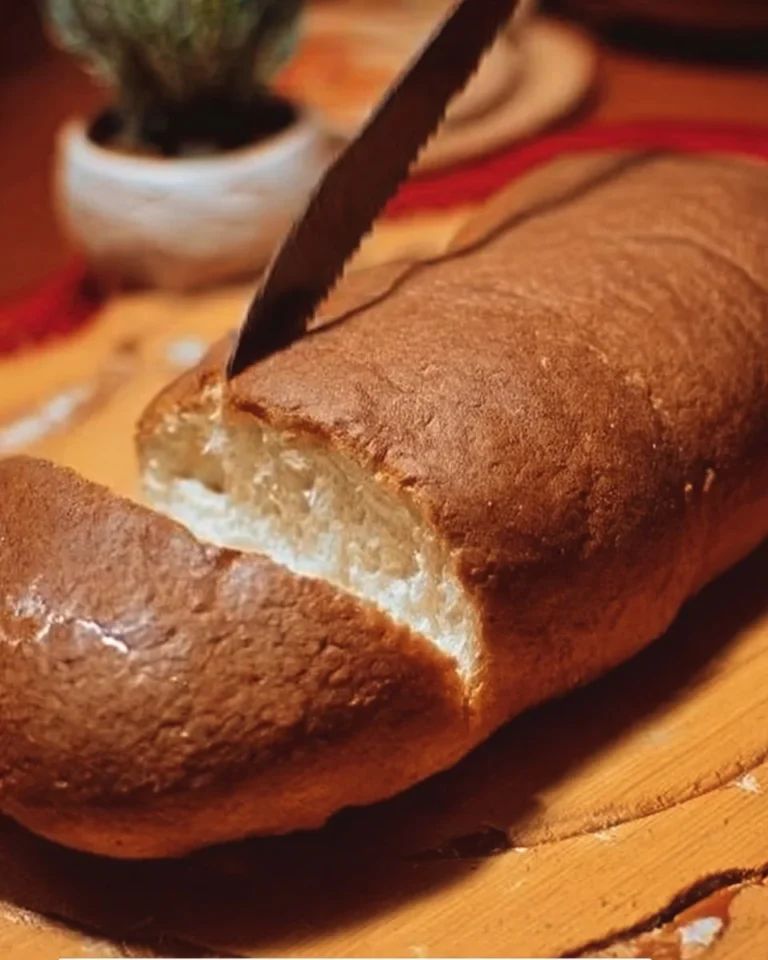 Homemade bread recipe with fresh ingredients and baking tools.
