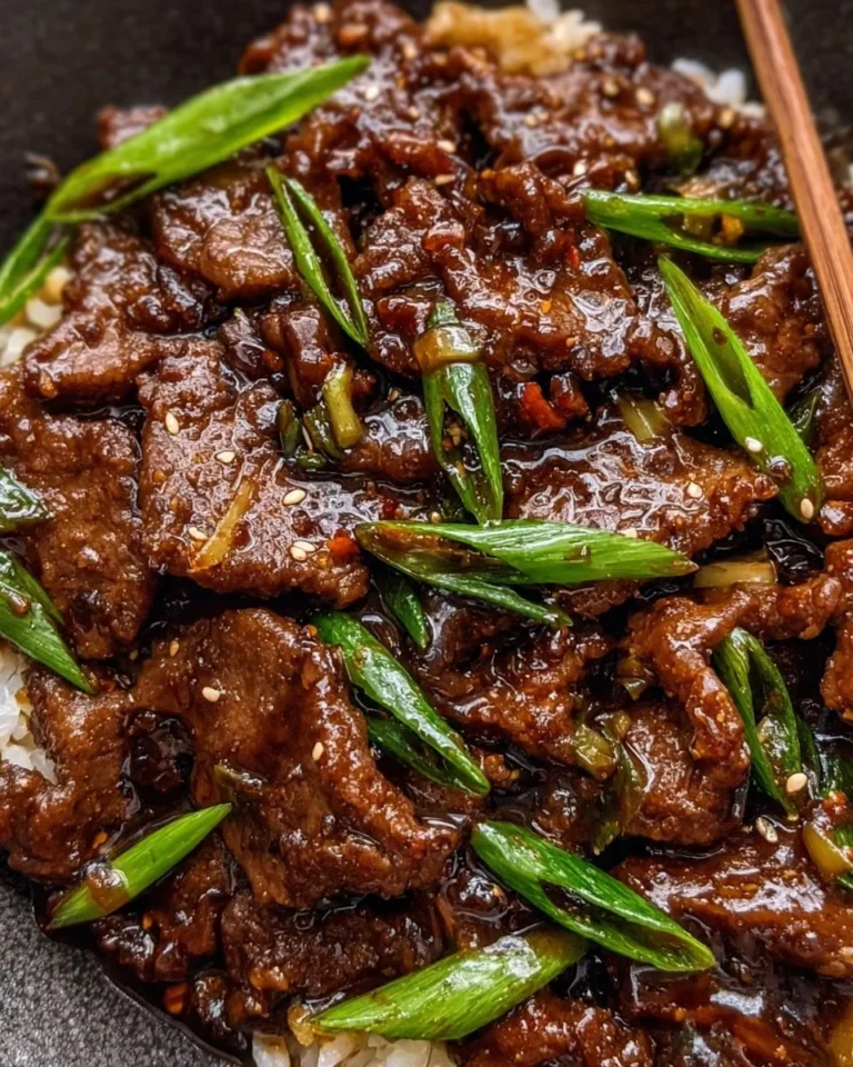 Delicious plate of easy Mongolian Beef served with rice and green onions
