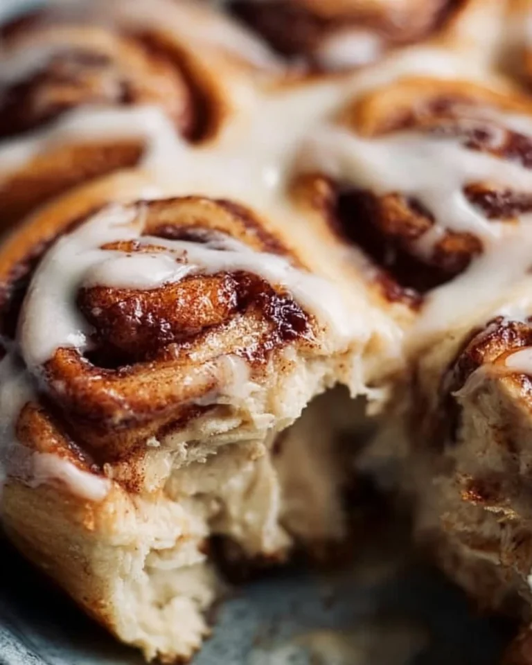 Delicious homemade cinnamon rolls topped with creamy icing