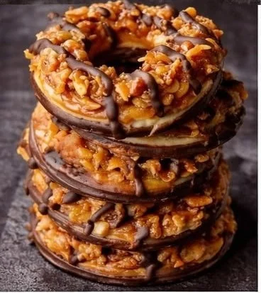 Delicious homemade Samoas Cookies topped with chocolate and caramel.