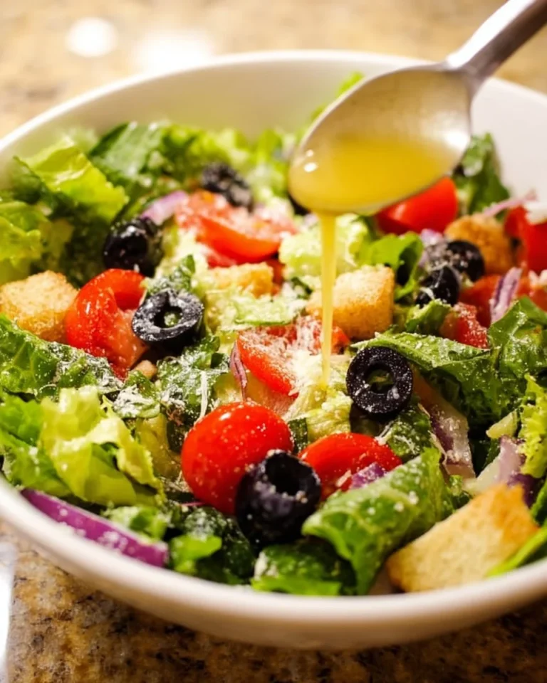 Fresh Olive Garden Salad with greens, olives, and Italian dressing