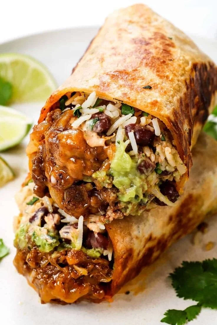 Delicious beef burritos with chipotle sauce ready to be served.