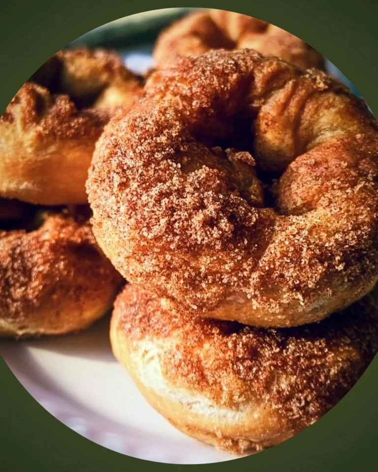 Freshly baked cinnamon crunch bagels on a wooden table