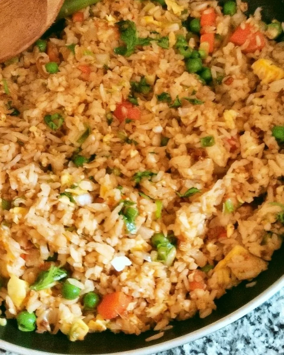 Bowl of quick and easy homemade fried rice with vegetables and eggs