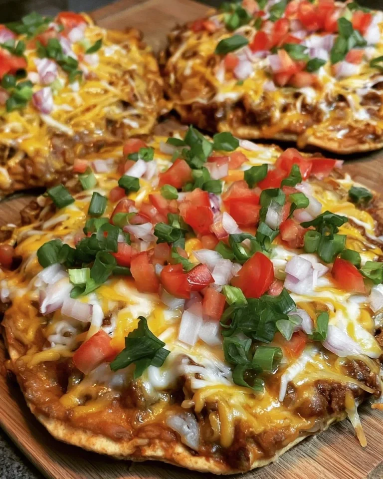 Homemade Taco Bell Mexican Pizza on a plate with toppings.