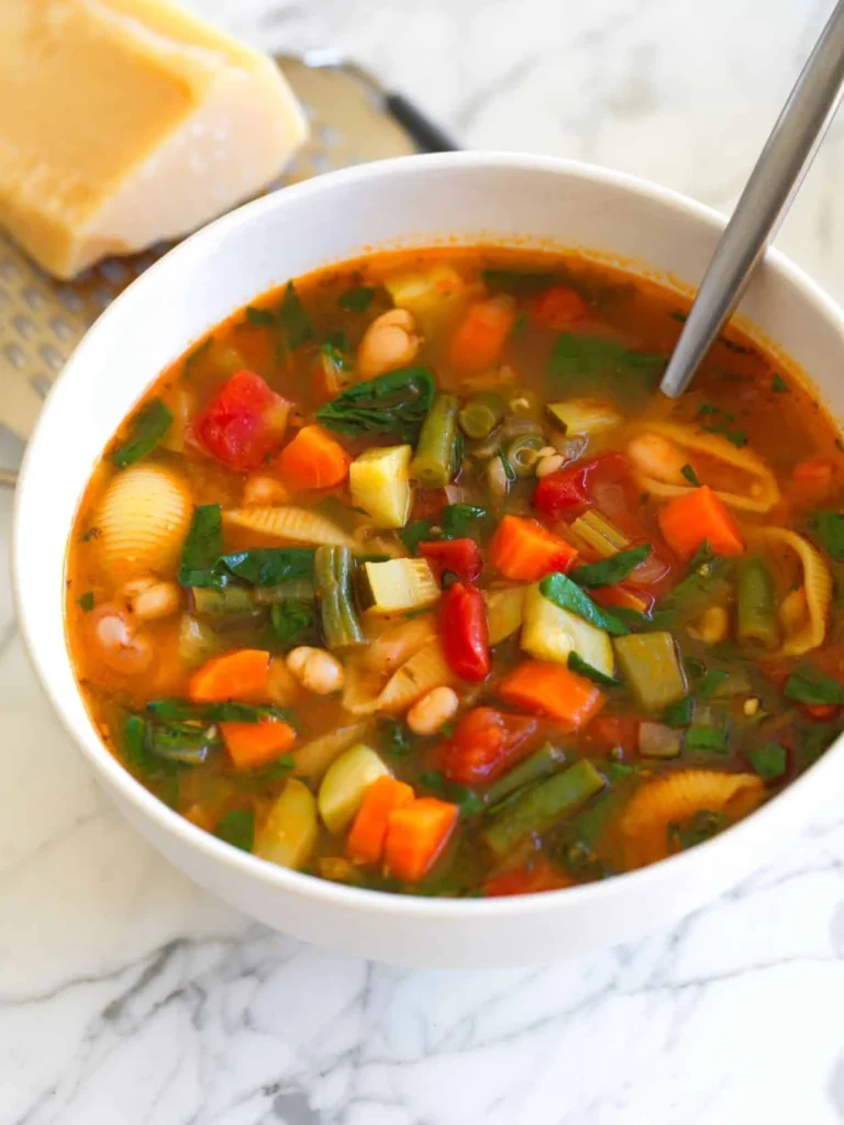 Bowl of hearty minestrone soup with fresh vegetables and pasta
