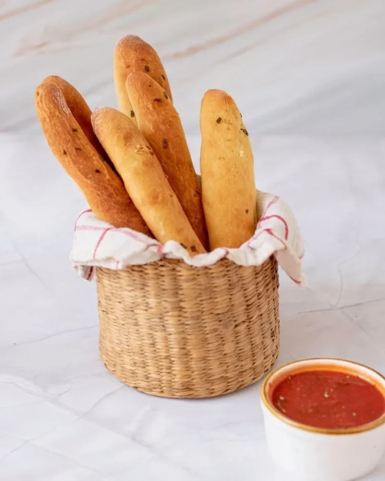 Homemade Olive Garden-style breadsticks served warm with butter.