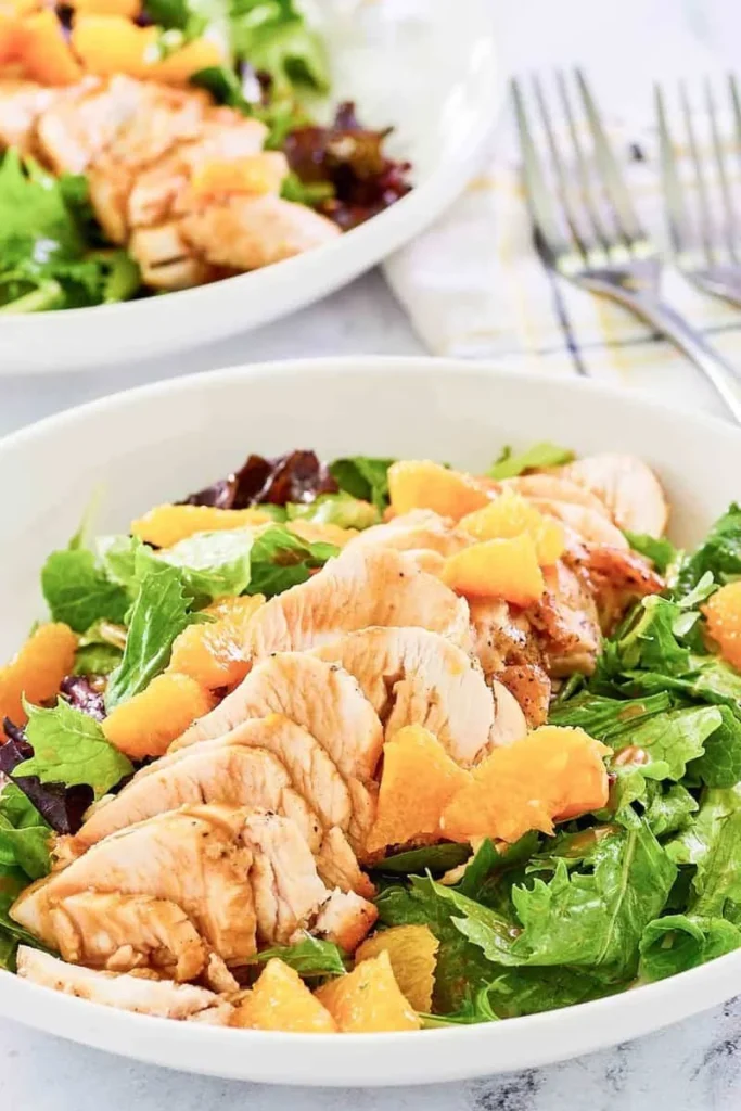 TGI Friday's Mandarin Orange Salad with Chicken served in a bowl
